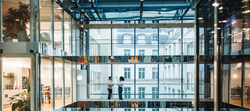 Diverse Businesswomen Networking on Office Balcony